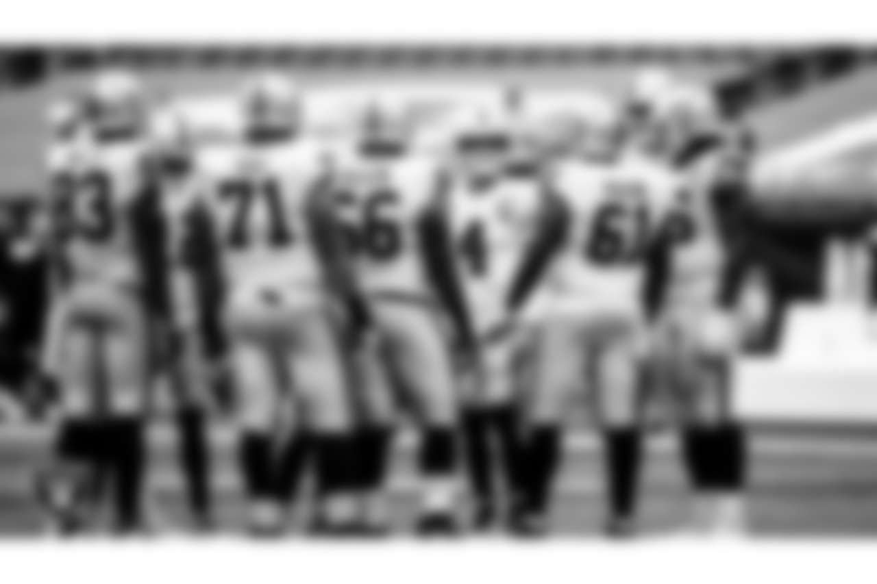 Las Vegas Raiders quarterback Derek Carr (4) calls a play in the huddle during the regular season away game against the New England Patriots.