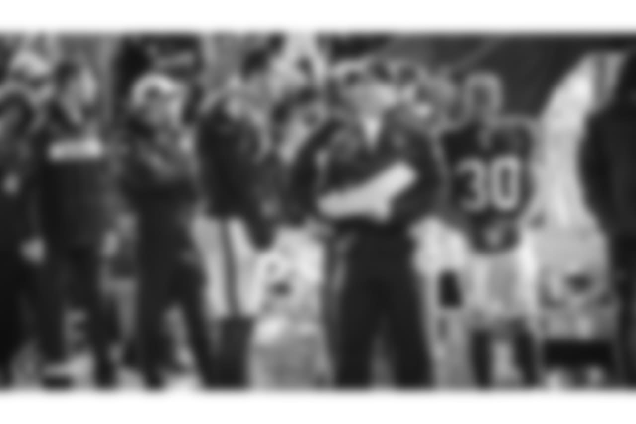 Oakland Raiders quarterback Derek Carr (4) and head coach Jon Gruden during The Oakland Raiders regular season game against the Denver Broncos at Oakland-Alameda County Coliseum, Monday, December 24, 2018, in Oakland, California. The Oakland Raiders won 24-17.