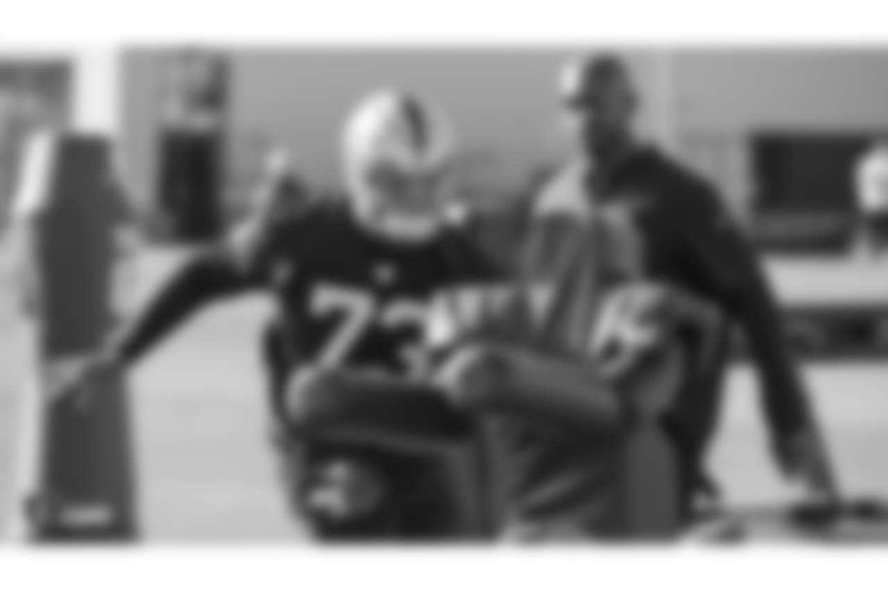 Oakland Raiders defensive tackle Maurice Hurst (73) and assistant defensive line coach Marco Coleman on the field for practice at the Oakland Raiders Practice Facility, Wednesday, December 26, 2018, in Alameda, California.
