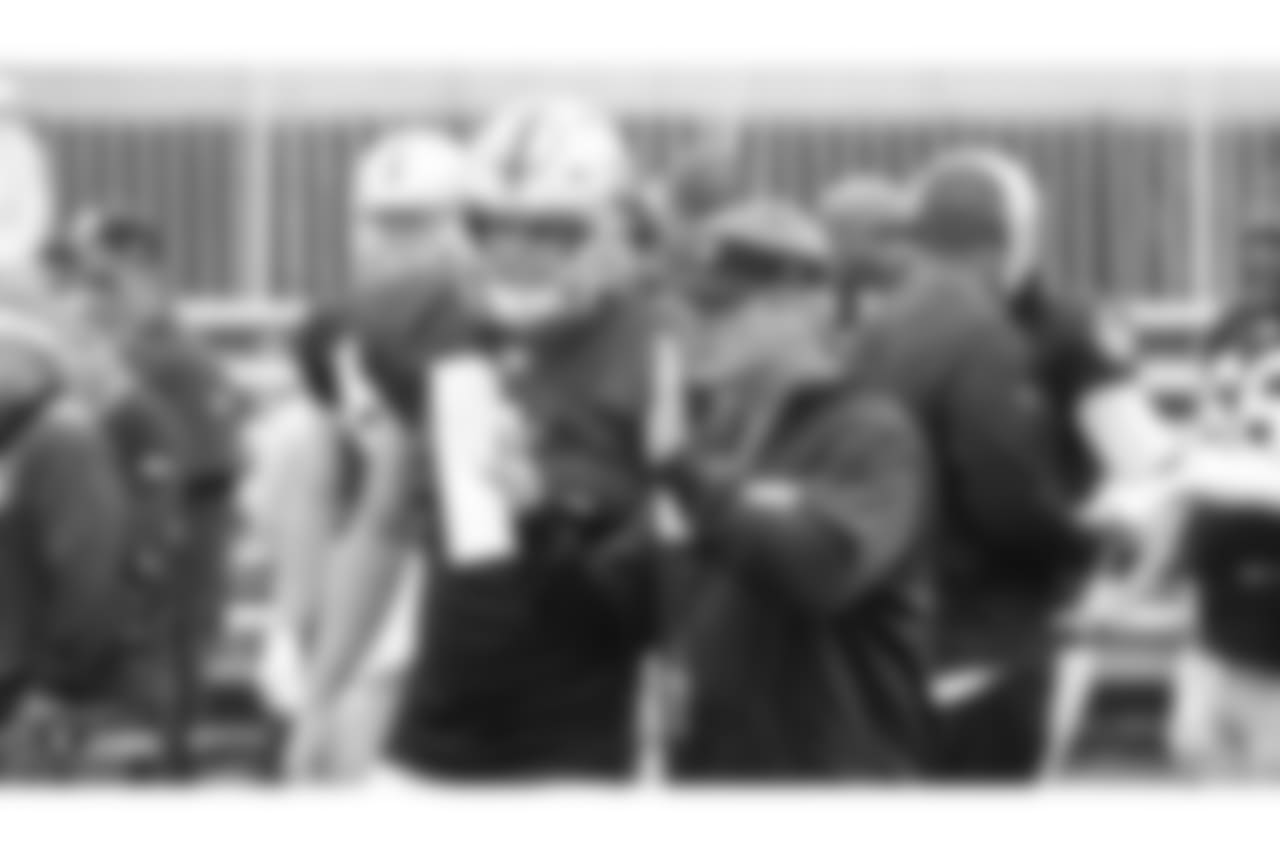 Oakland Raiders head coach Jon Gruden and quarterback Derek Carr (4) on the field for practice at 2018 Training Camp at The Oakland Raiders Napa Valley Training Complex, Monday, August 13, 2018, in Napa, California.