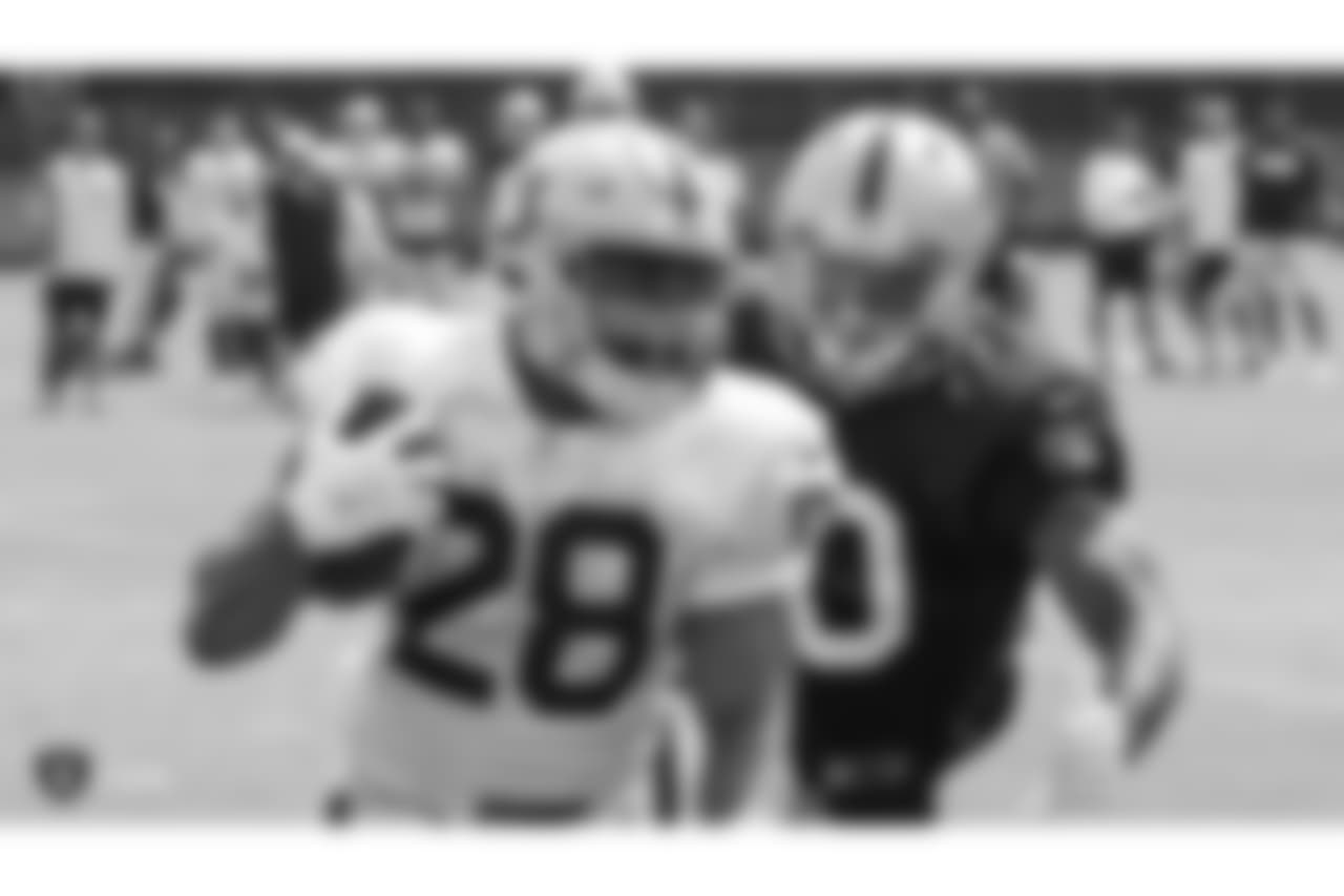 Oakland Raiders running back Doug Martin (28) and linebacker Nicholas Morrow (50) on the field for practice at 2018 Training Camp at The Oakland Raiders Napa Valley Training Complex, Friday, August 3, 2018, in Napa, California.