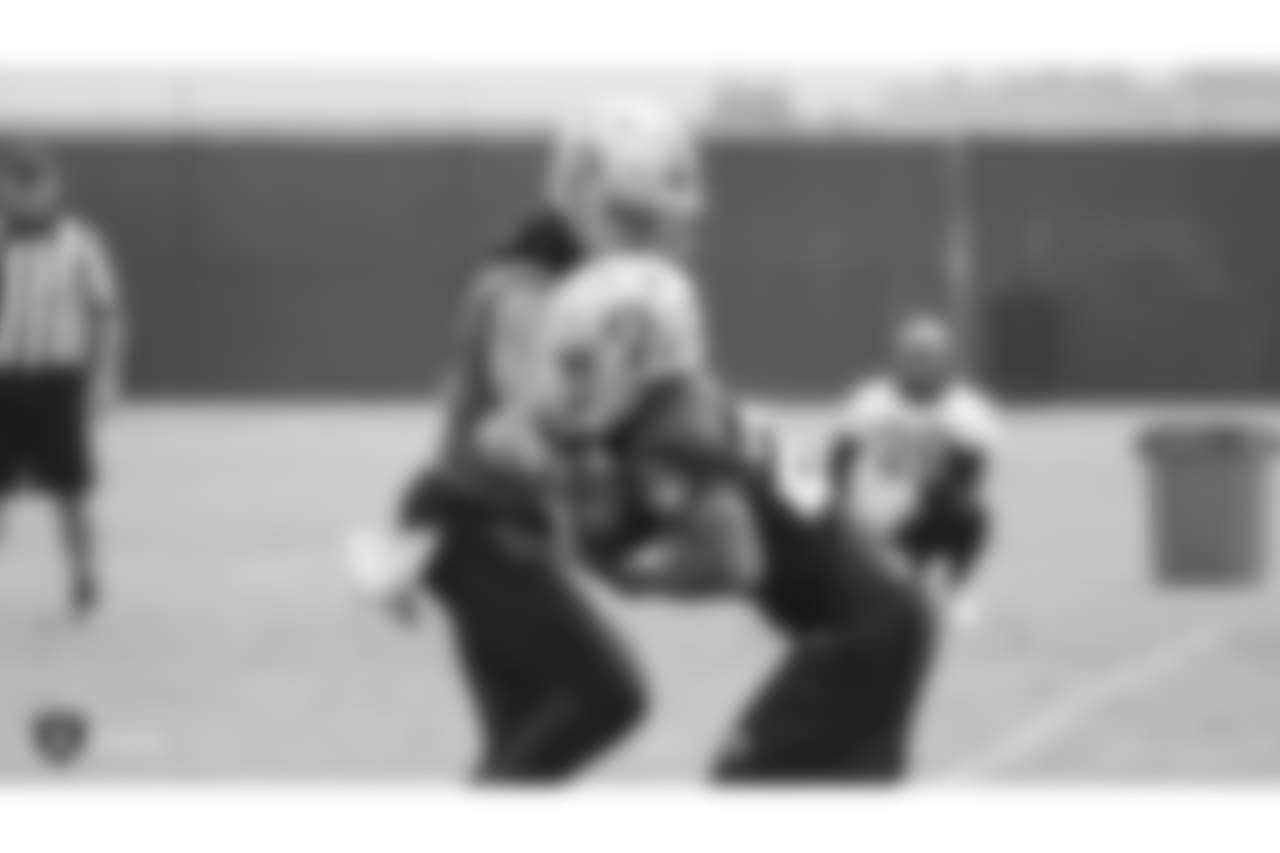 Oakland Raiders quarterback Derek Carr (4) and running back Doug Martin (28) on the field for practice at the Oakland Raiders Practice Facility, Monday, October 22, 2018, in Alameda, California.