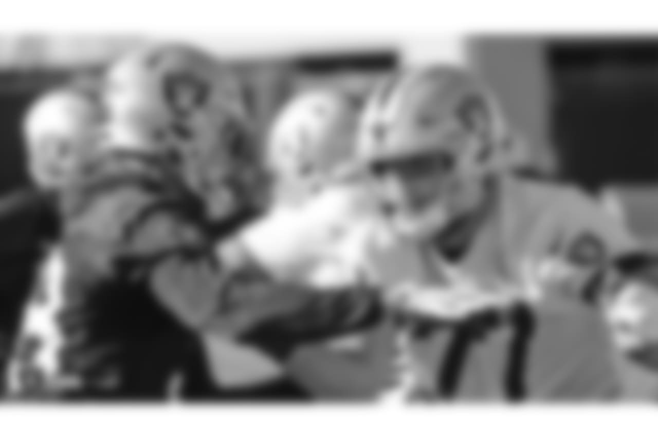 Oakland Raiders linebacker Kyle Wilber (58) and tackle Kolton Miller (77) on the field for practice at the Oakland Raiders Practice Facility, Friday, December 28, 2018, in Alameda, California.