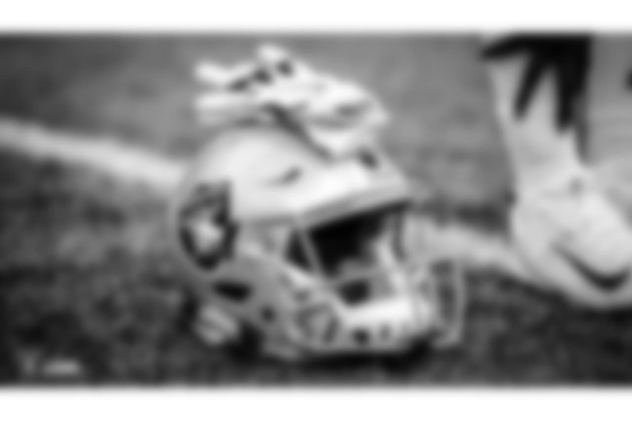 An Oakland Raiders helmet and gloves at The Oakland Raiders preseason game against the Seattle Seahawks at CenturyLink Field, Thursday, August 30, 2018, in Seattle, Washington. The Oakland Raiders won 30-19.