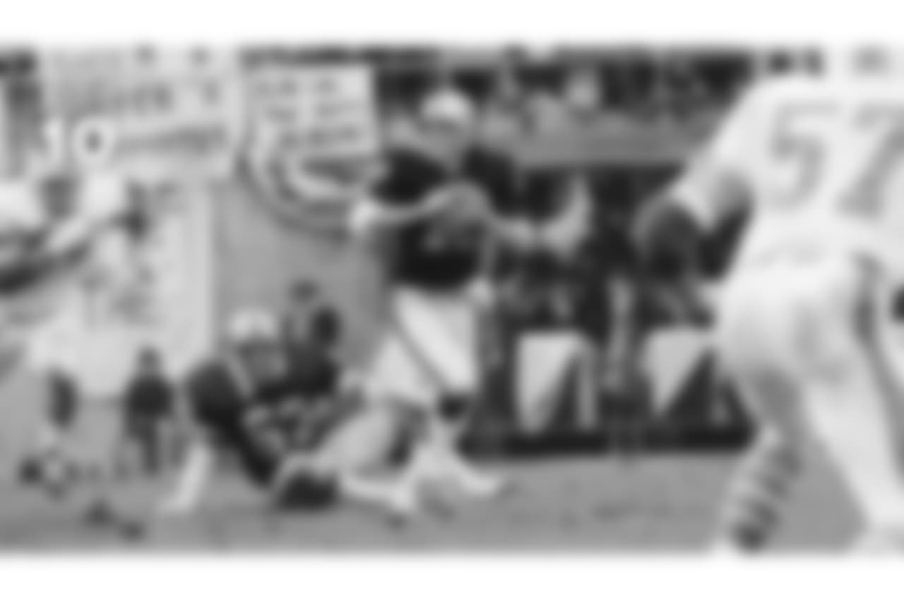 (**7\. Ken Stabler, 1974 AFC Divisional Playoff**) In a 1974 AFC Divisional Playoff Game, quarterback Ken Stabler completed 20 of 30 pass attempts for 293 yards, 4 TDs and 1 INT in a 28-26 win over the Miami Dolphins.