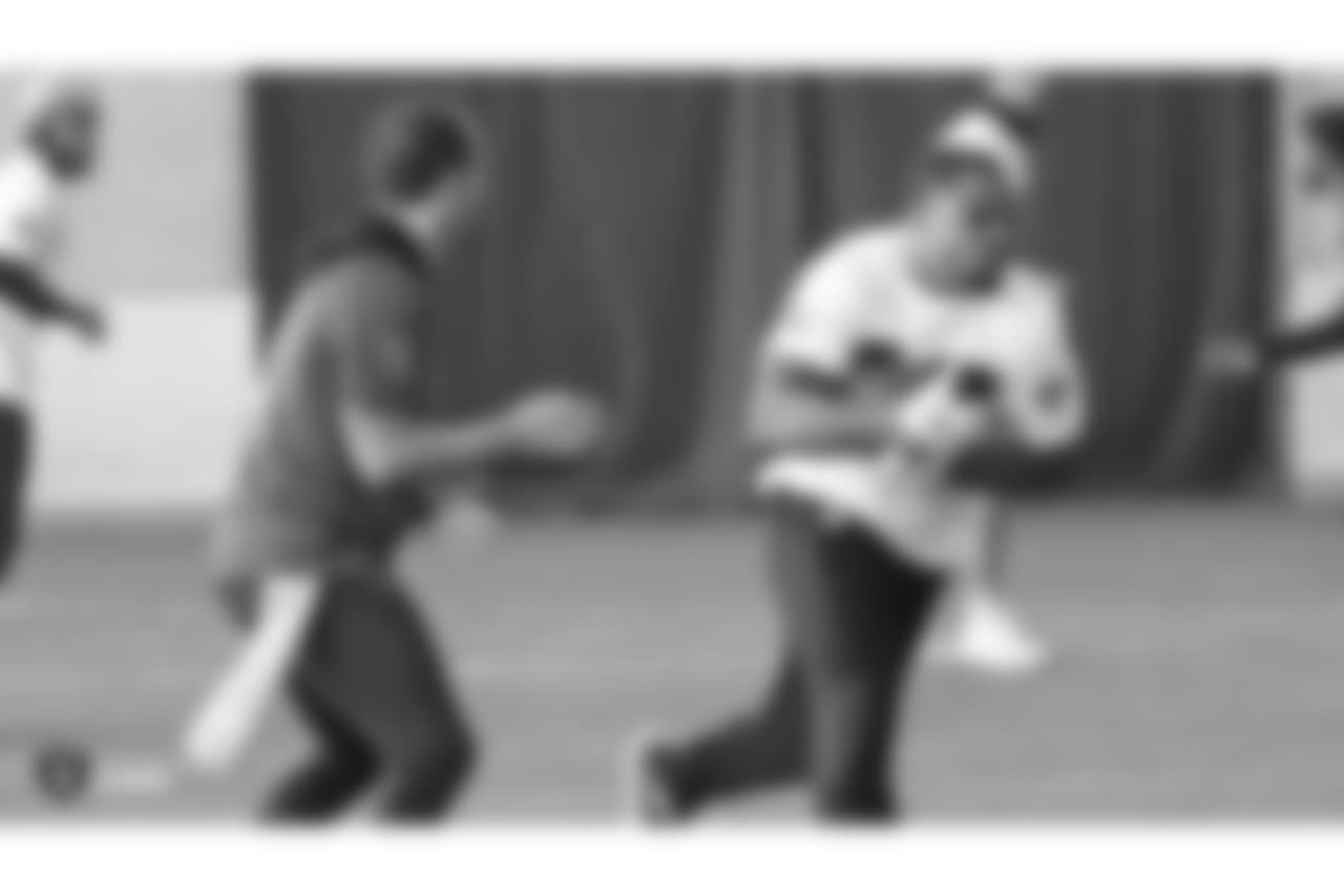 Oakland Raiders quarterback Derek Carr (4) and running back Doug Martin (28) on the field for a walk through at Bladium Sports & Fitness, Friday, November 16, 2018, in Alameda, California.