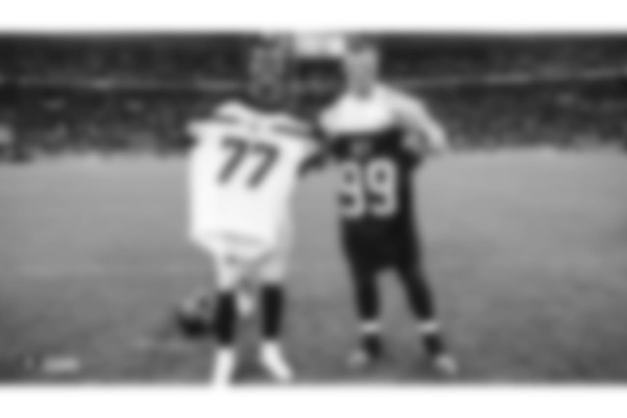 Oakland Raiders defensive end Arden Key (99) swaps jerseys with Seattle Seahawks center/guard Ethan Pocic (77) after the Oakland Raiders regular game against the Seattle Seahawks at Wembley Stadium, Sunday, October 14, 2018, in London, England. The Oakland Raiders lost 27-3.