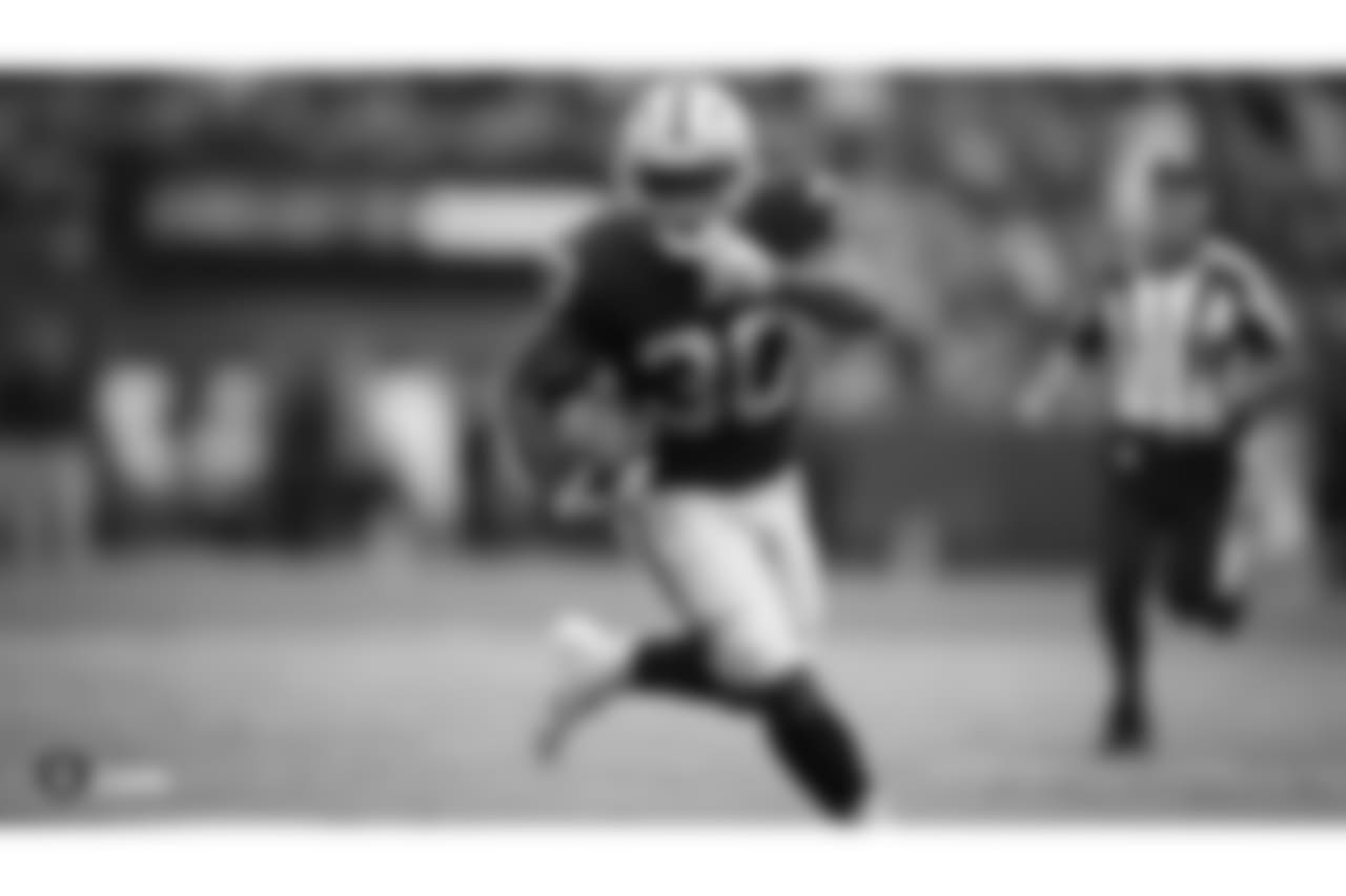 Oakland Raiders running back Jalen Richard (30) makes a play during the Oakland Raiders regular season game against the Cleveland Browns at Oakland-Alameda County Coliseum on September 30th, 2018, in Oakland, California. The Oakland Raiders won 45-42.
