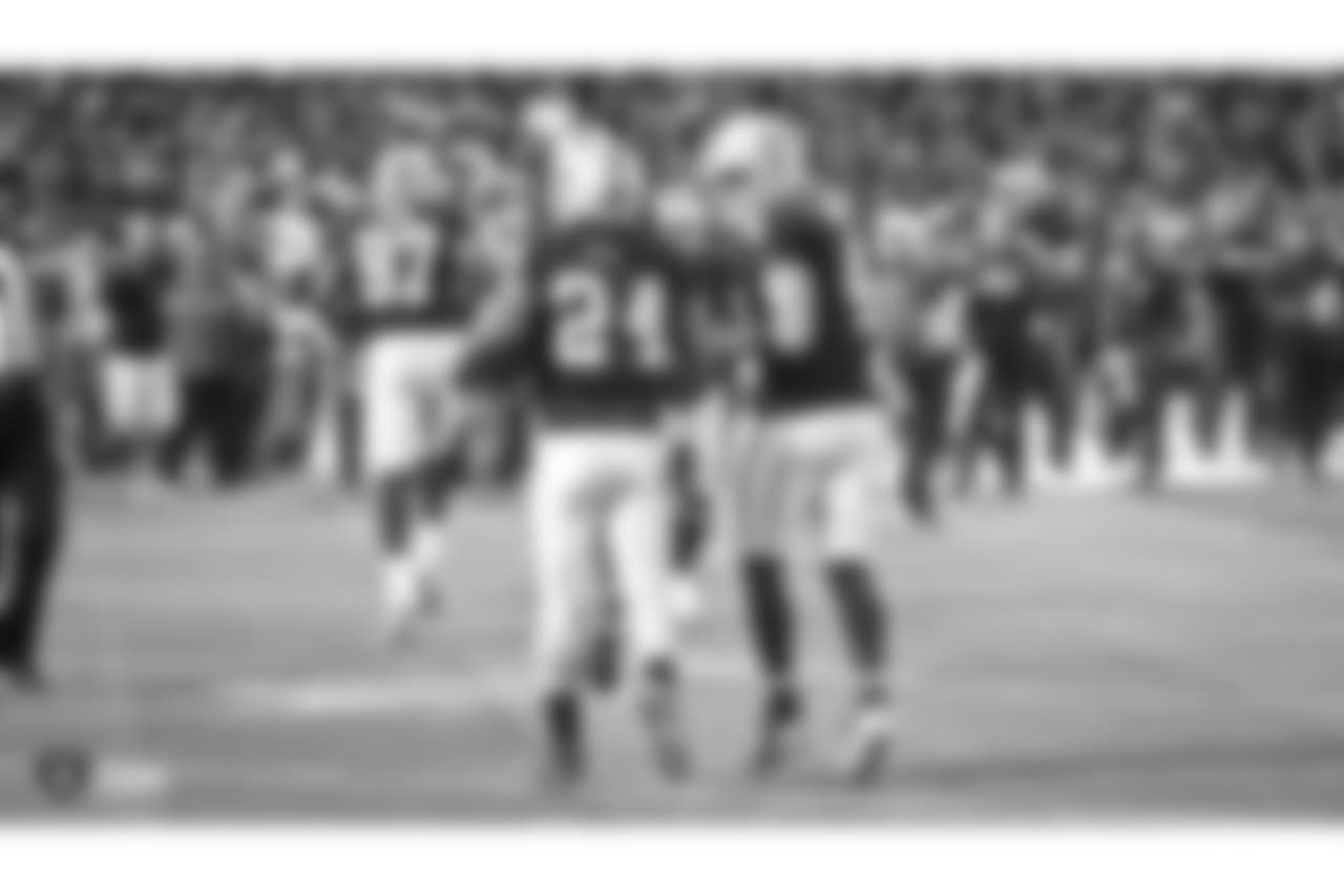 Oakland Raiders running back Marshawn Lynch (24) and quarterback Derek Carr (4) during The Oakland Raiders regular season game against the Los Angeles Rams at Oakland-Alameda County Coliseum, Monday, September 10, 2018, in Oakland, California. The Oakland Raiders lost 33-13.