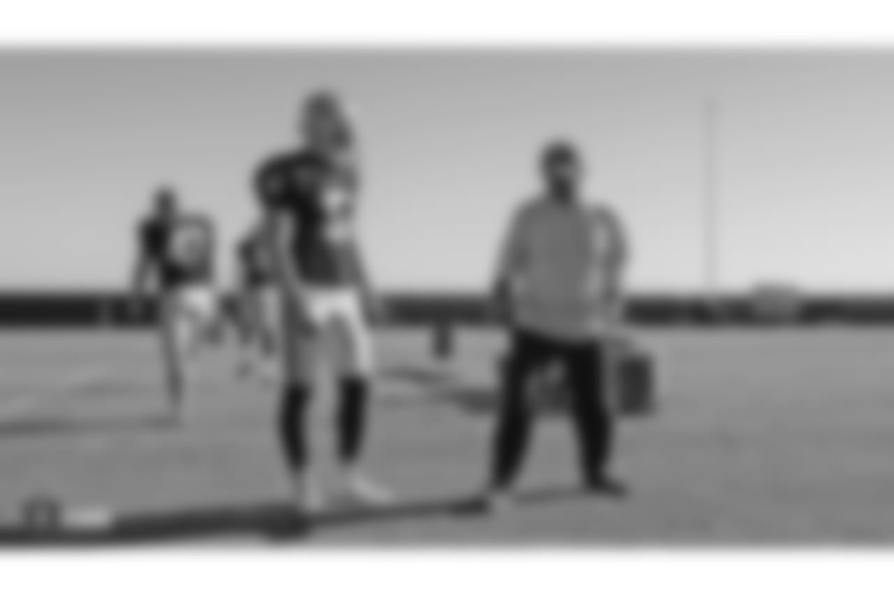 Oakland Raiders punter Johnny Townsend (5) and assistant head coach and special teams coordinator Rich Bisaccia on the field for practice at the Oakland Raiders Practice Facility, Wednesday, November 7, 2018, in Alameda, California.