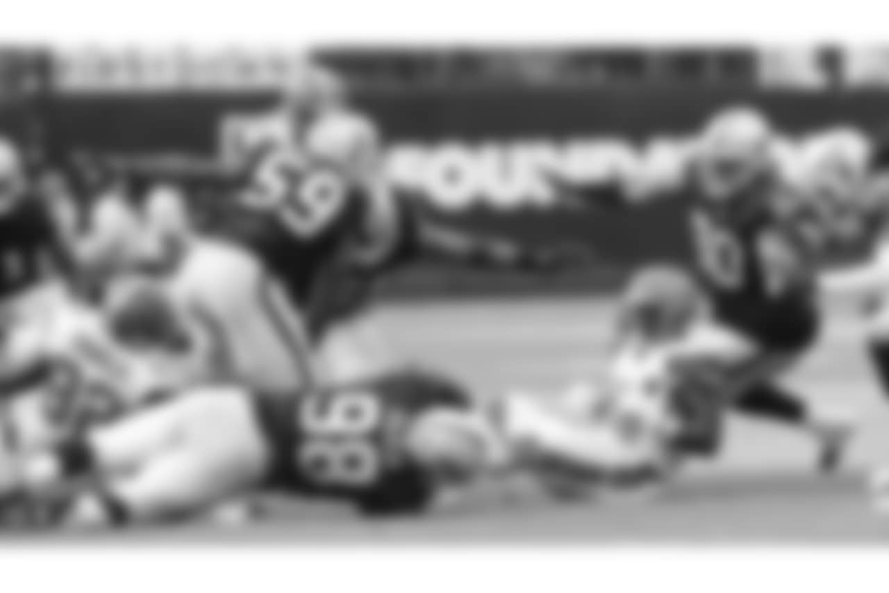 Oakland Raiders linebacker Tahir Whitehead (59), defensive tackle Frostee Rucker (98), and defensive tackle Jonathan Hankins (90) during The Oakland Raiders regular season game against the Cleveland Browns at Oakland-Alameda County Coliseum, Sunday, September 30, 2018, in Oakland, California. The Oakland Raiders won 45-42.