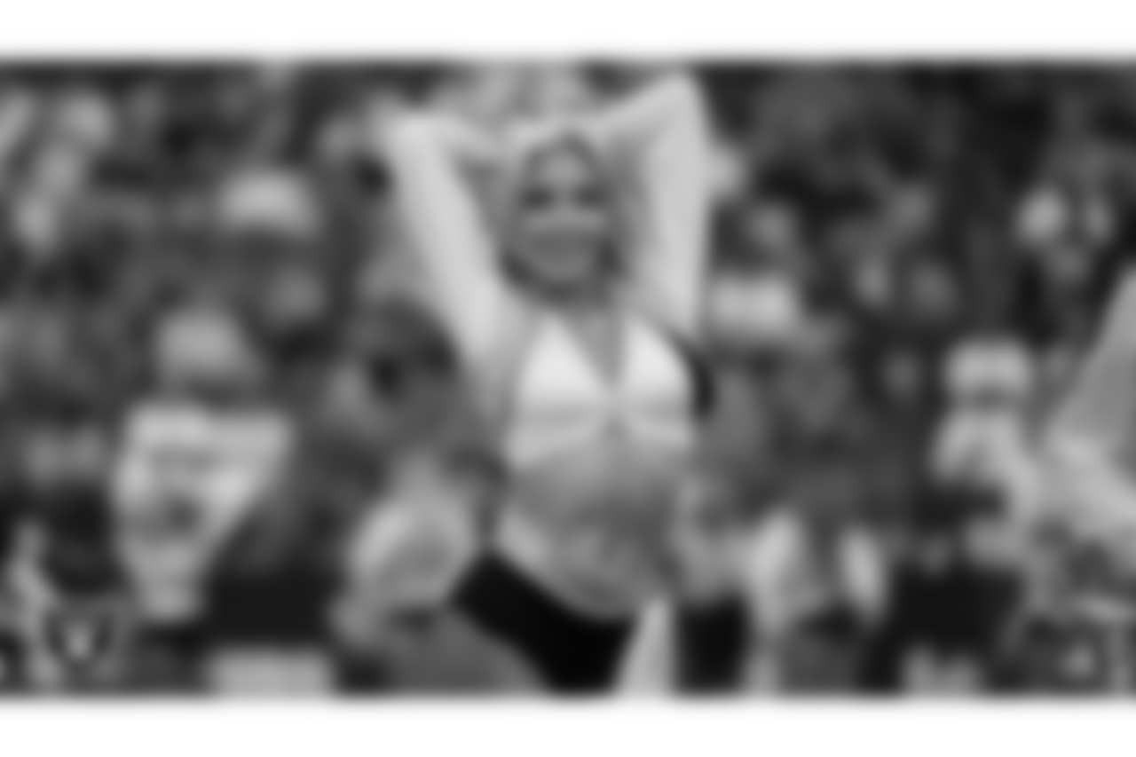 Raiderette Megan performs on the field during the preseason home game against the San Francisco 49ers at Allegiant Stadium.
