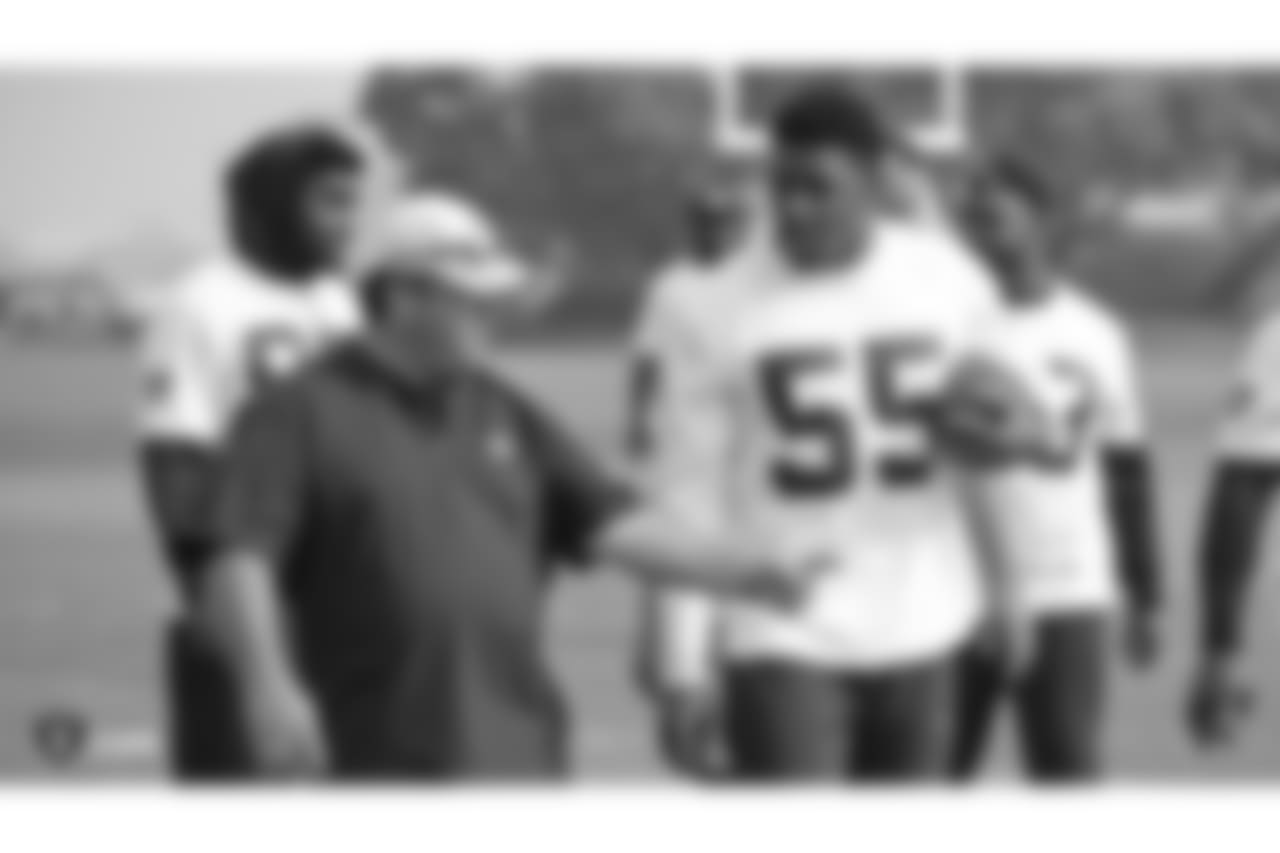 Oakland Raiders defensive coordinator Paul Guenther and linebacker Marquel Lee (55) on the field for practice at the Oakland Raiders Practice Facility, Friday, November 9, 2018, in Alameda, California.