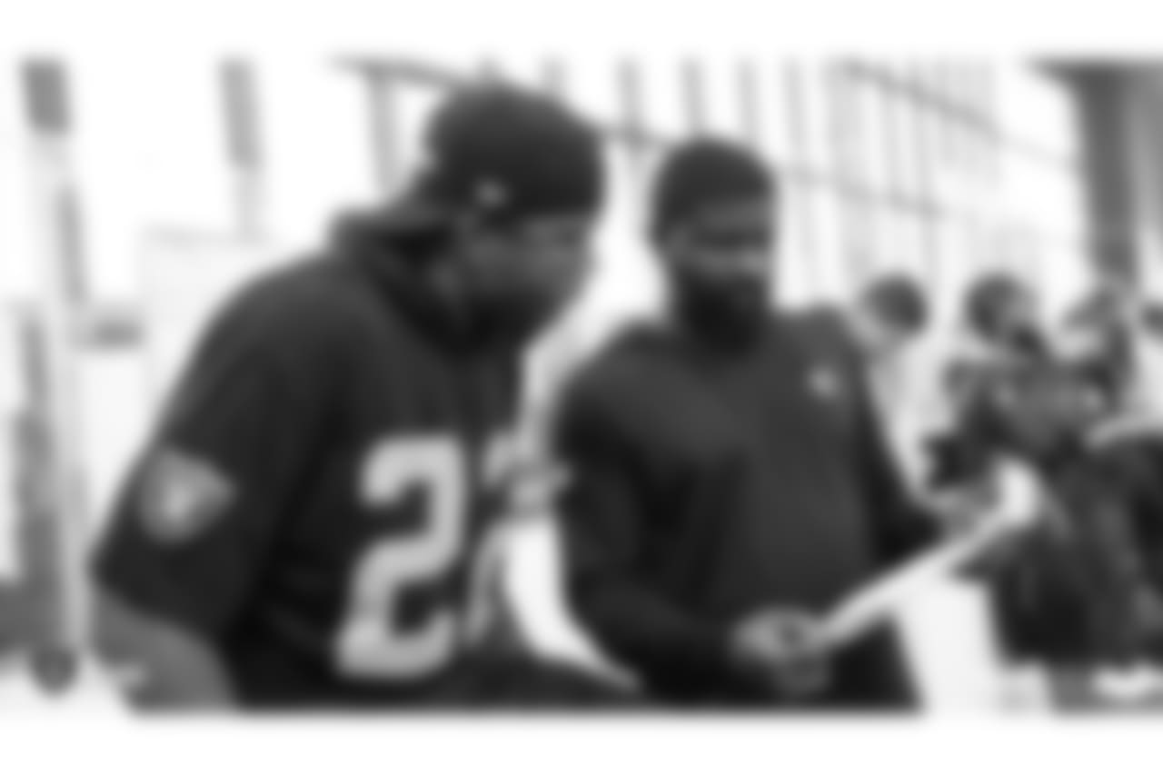 Oakland Raiders cornerback Rashaan Melvin (22) and defensive backs coach Derrick Ansley on the field for a walk through at Bladium Sports & Fitness, Friday, November 16, 2018, in Alameda, California.
