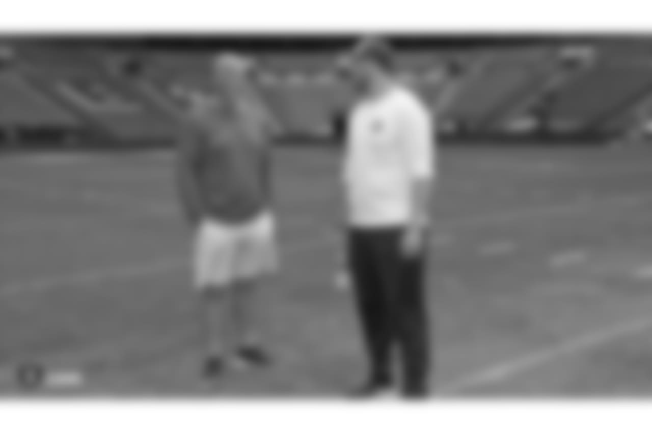 Oakland Raiders offensive line coach Tom Cable and his son and coaching assistant Zach Cable on the field for a walk through before their game against the Seattle Seahawks, Saturday, October 13, 2018, in London, England.