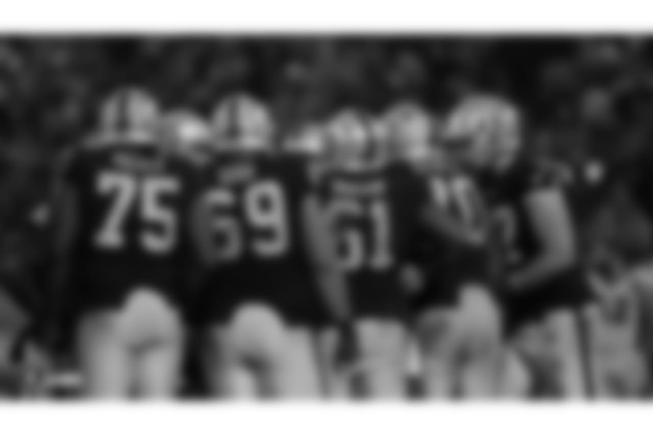 The Raiders offensive line in their Week 16 matchup against the Denver Broncos at the Coliseum.
