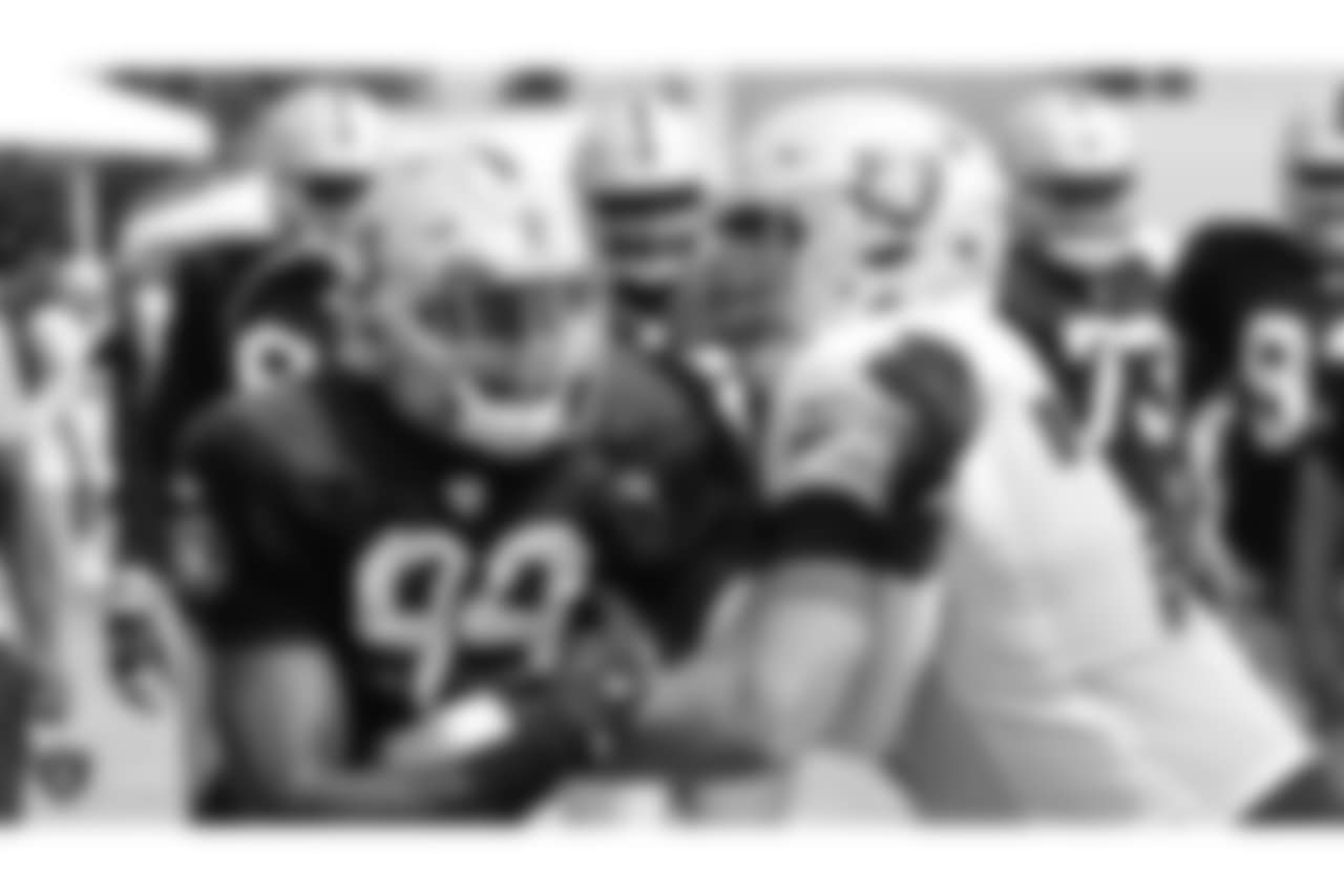 Oakland Raiders defensive end Arden Key (99) and offensive tackle Kolton Miller (77) on the field for practice at 2018 Training Camp at The Oakland Raiders Napa Valley Training Complex, Friday, August 3, 2018, in Napa, California.