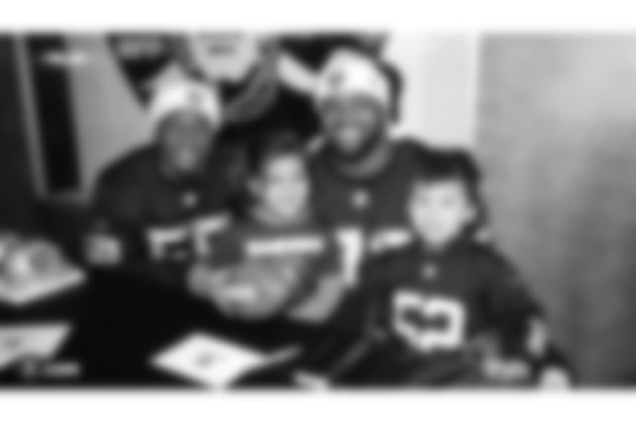 The Raiders Foundation hosts a Toys for Tots drive where guests have the chance to meet Oakland Raiders linebacker Jason Cabinda (53), linebacker Marquel Lee (55), and defensive tackle Maurice Hurst (73) in exchange for a toy or $20 donation to the charity, Tuesday, December 4, 2018, in Hayward, California.