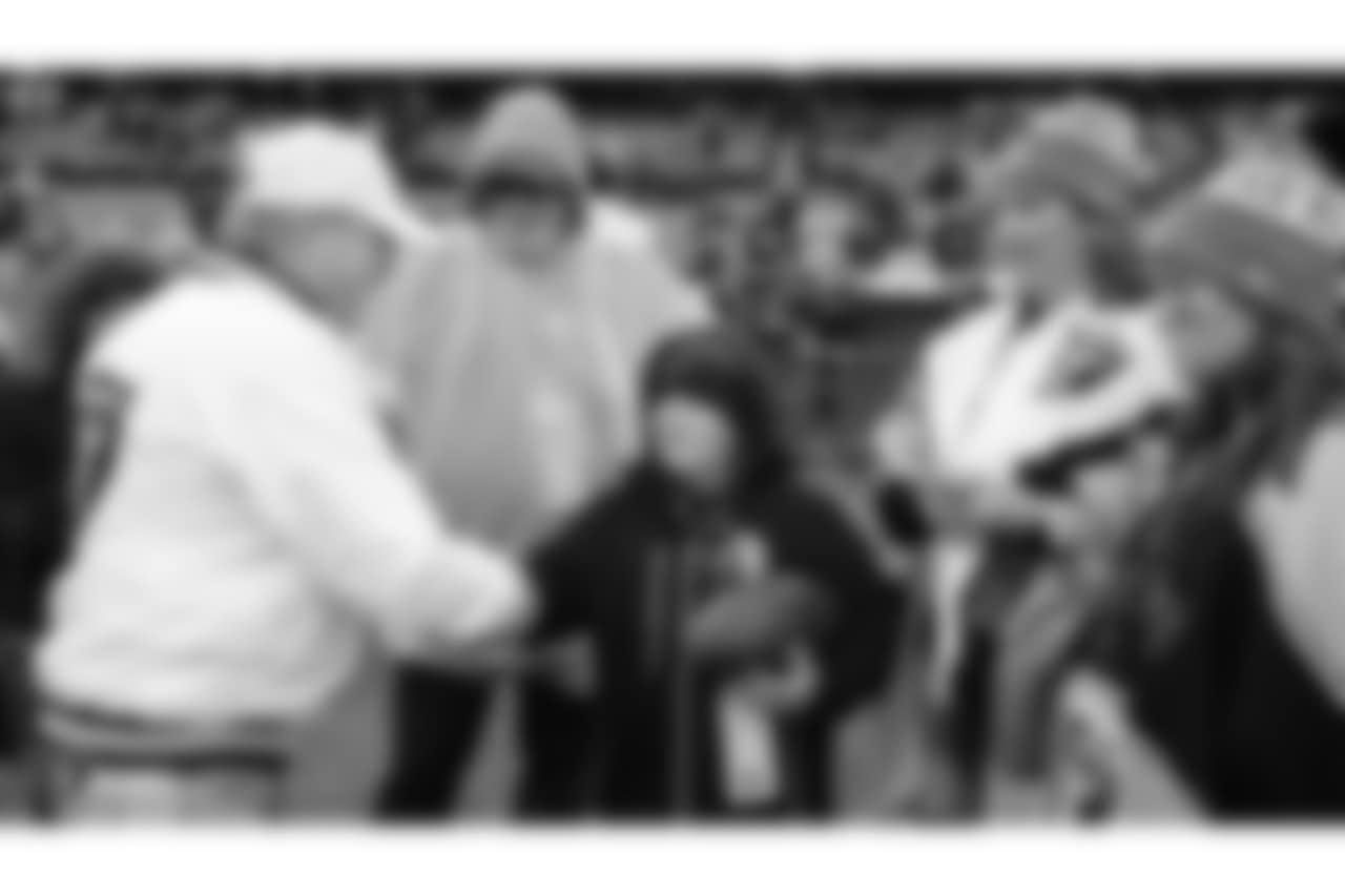 Zander of the Make-A-Wish Foundation stands with his family on the sidelines before the Oakland Raiders regular season game against the Denver Broncos at Oakland-Alameda County Coliseum, Monday, December 24, 2018, in Oakland, California. The Oakland Raiders won 24-17.