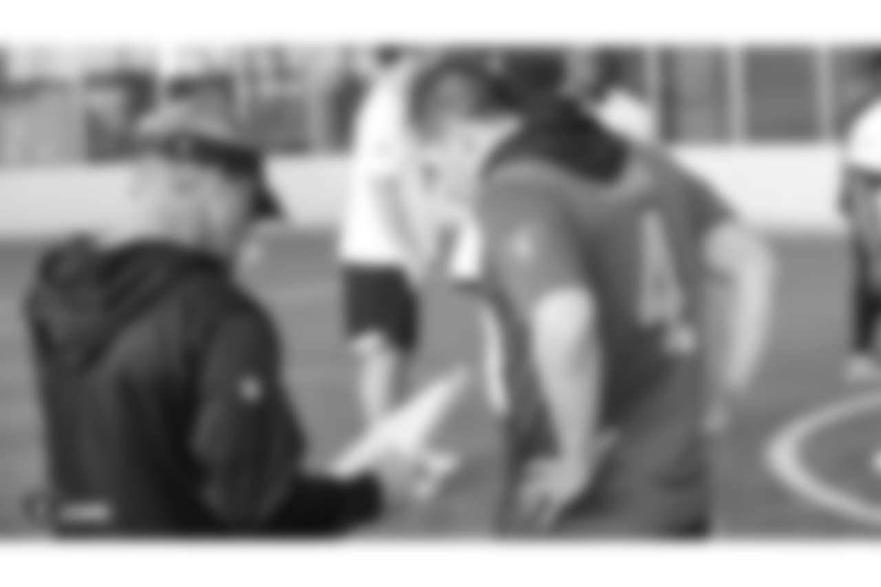 Oakland Raiders head coach Jon Gruden and quarterback Derek Carr (4) on the field for a walk through at Bladium Sports & Fitness, Friday, November 16, 2018, in Alameda, California.