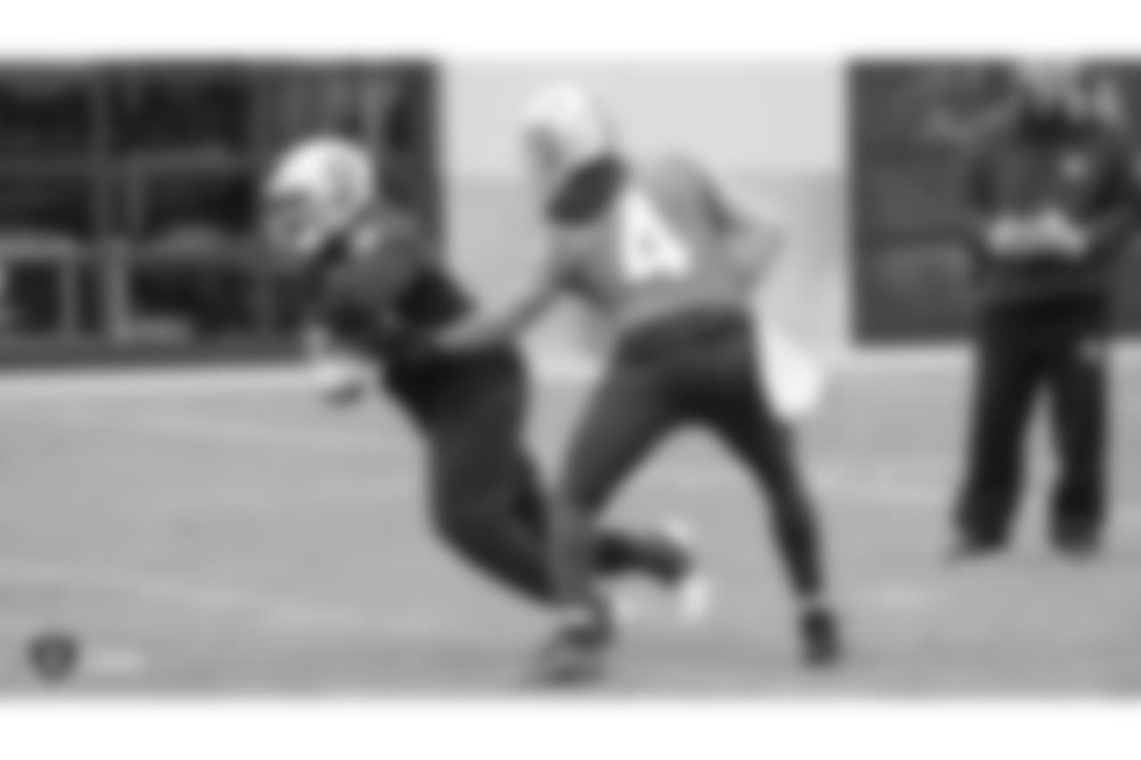 Oakland Raiders running back C.J. Anderson (35) and quarterback Derek Carr (4) on the field for practice at the Oakland Raiders Practice Facility, Wednesday, December 5, 2018, in Alameda, California.