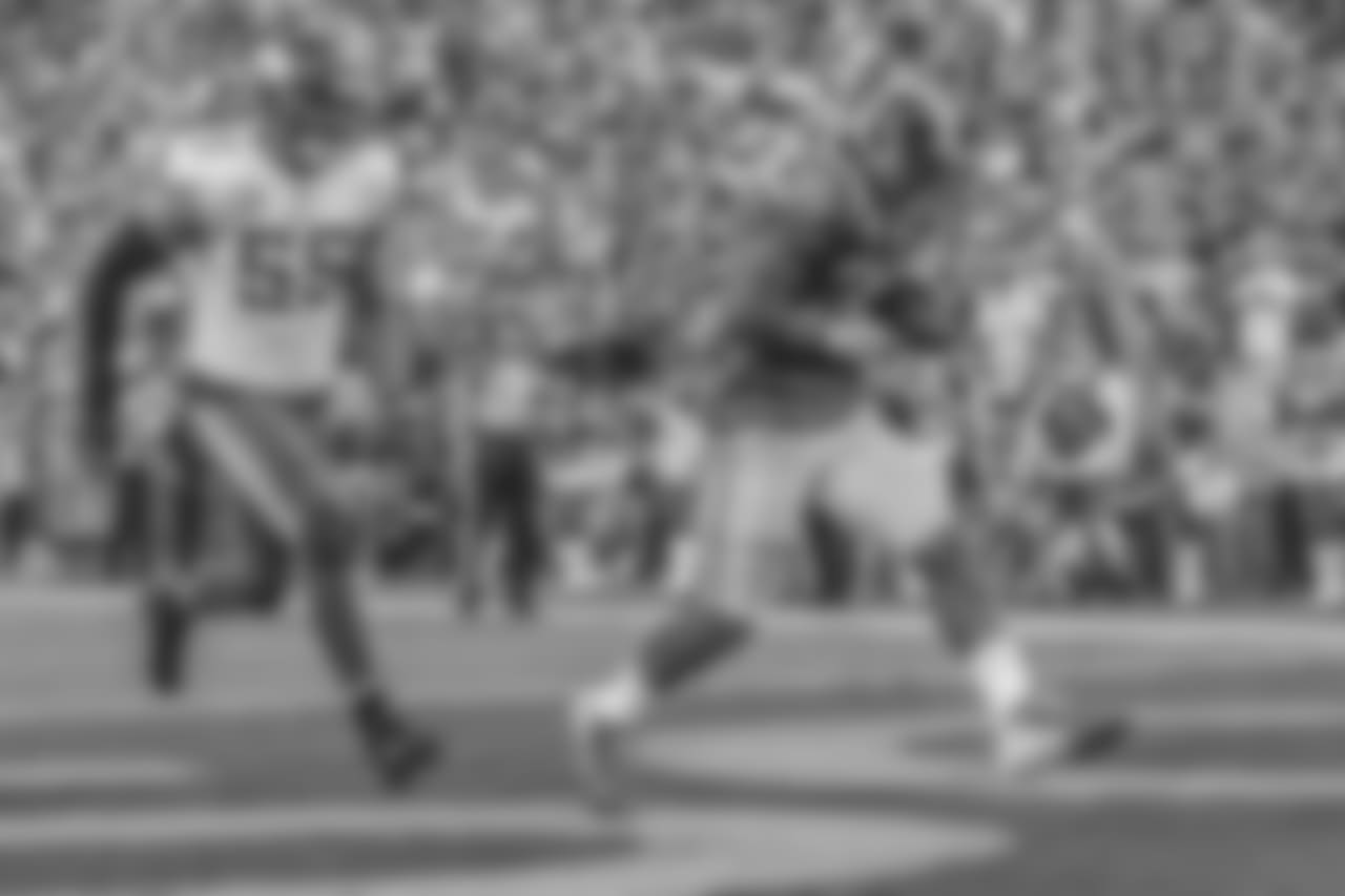 Los Angeles Rams running back Todd Gurley (30) catches a touchdown pass during an NFL Week 4 Football game against the Minnesota Vikings. The Thursday Night Football game was simulcast on NFL Network, FOX, and Amazon Prime Video at the Los Angeles Memorial Coliseum in Los Angeles, Calif. on September 27th, 2018 (Hiro Ueno/Rams).