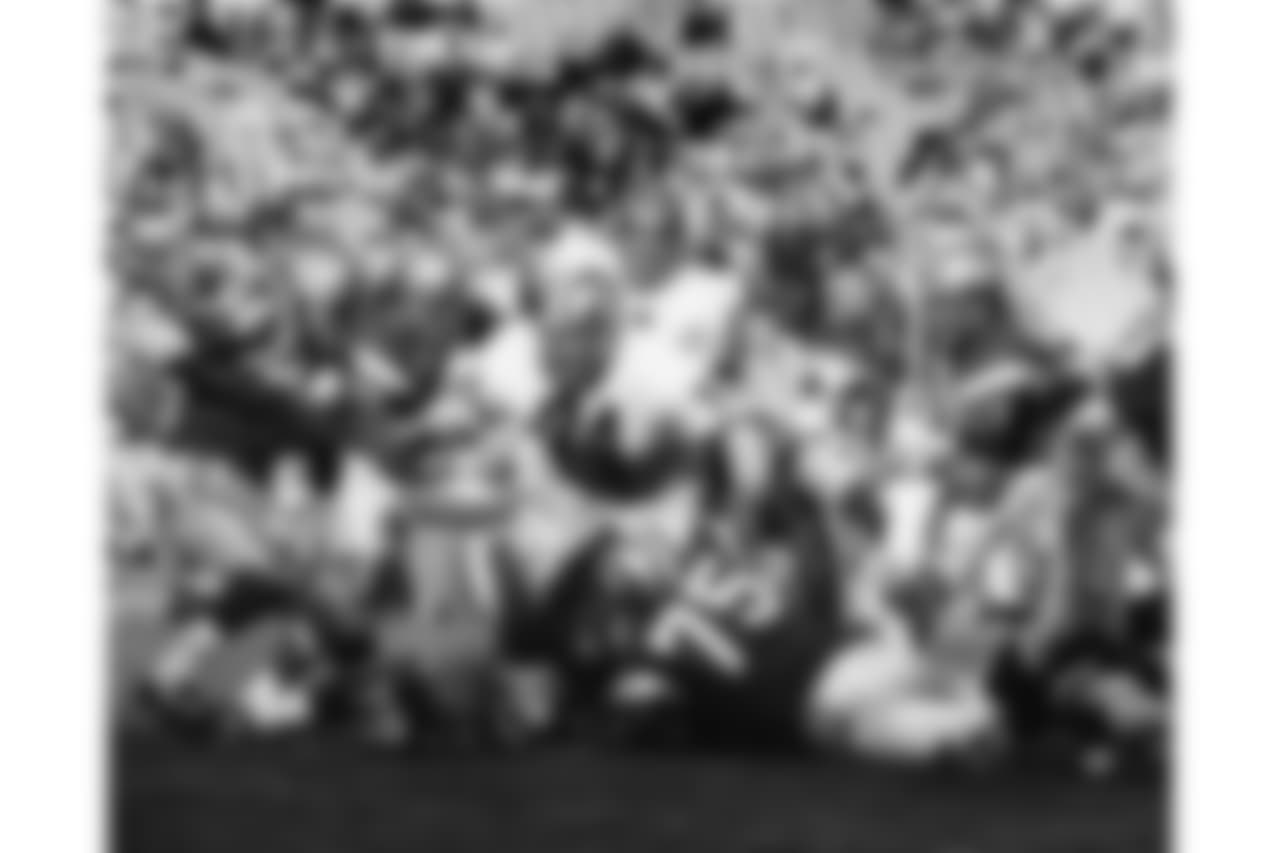 Rams Hall of Fame defensive tackle Merlin Olsen (74) pursues Browns Hall of Fame running back Leroy Kelly (44) during the 1968 NFL Pro Bowl in Los Angeles, Calif., Jan. 21, 1968. The West defeated the East 38-20. (AP Photo/NFL Photos)