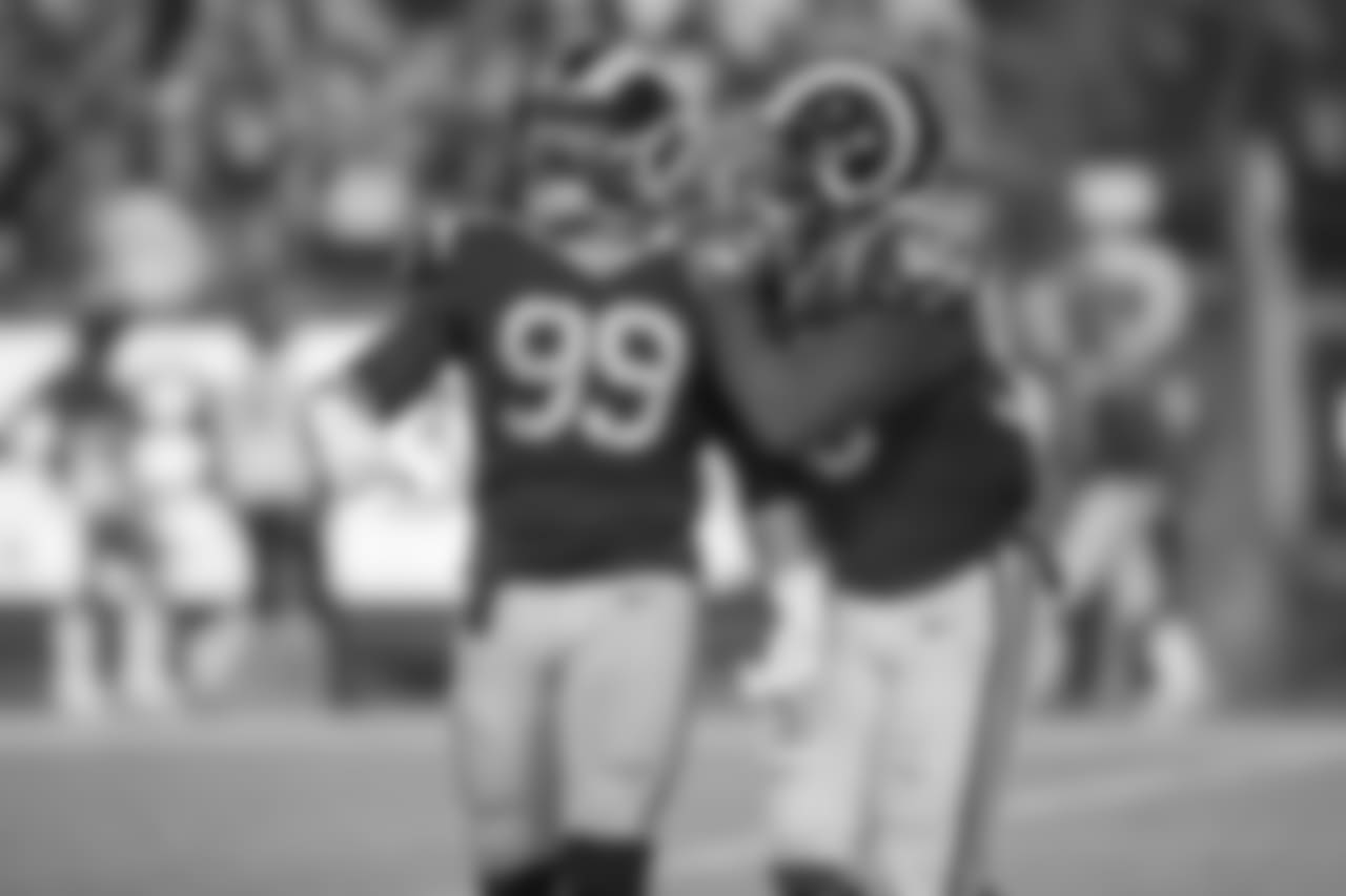 Defensive tackle (99) Aaron Donald of the Los Angeles Rams celebrates with teammate (50) Samson Ebukam after a sack against the Minnesota Vikings during the Rams 38-31 victory over the Vikings in an NFL Week 4 Thursday Night Football game, Thursday, September 27, 2018, in Los Angeles, CA. (Jeff Lewis/Rams)