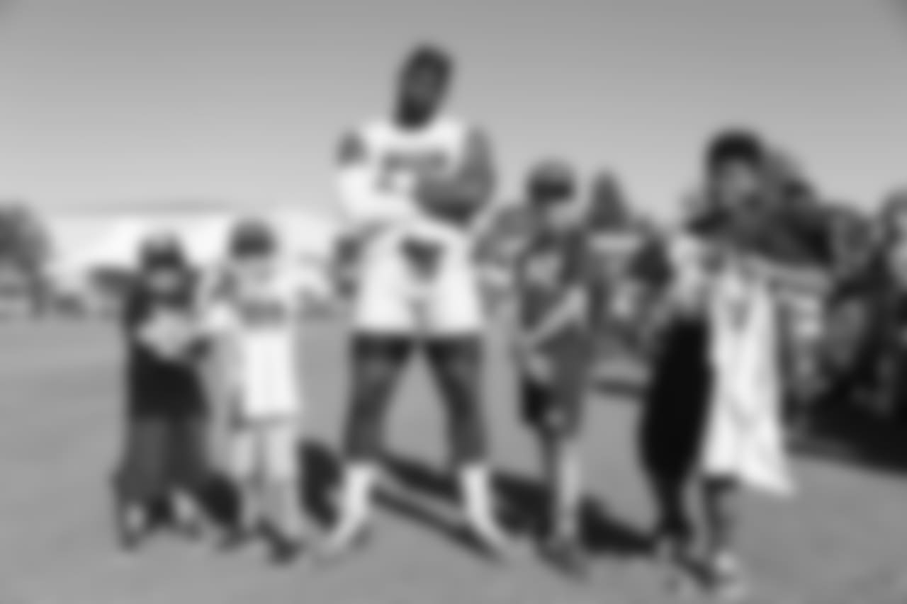 Defensive lineman (90) Michael Brockers of the Los Angeles Rams takes a photo with fans during Day 5 of Training Camp, Monday, July 30, 2018, in Irvine, CA. (Will Navarro/Rams)