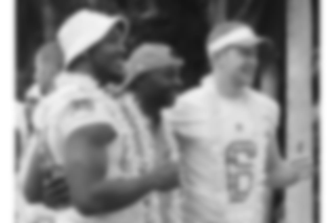Robert Quinn, left; Jerry Rice, Pro Bowl alumni team captain and Pro Football Hall of Famer; and Johnny Hekker, during picture day for the NFL football game, Friday, Jan. 24, 2014, in Hawaii. (AP Photo/Eugene Tanner)