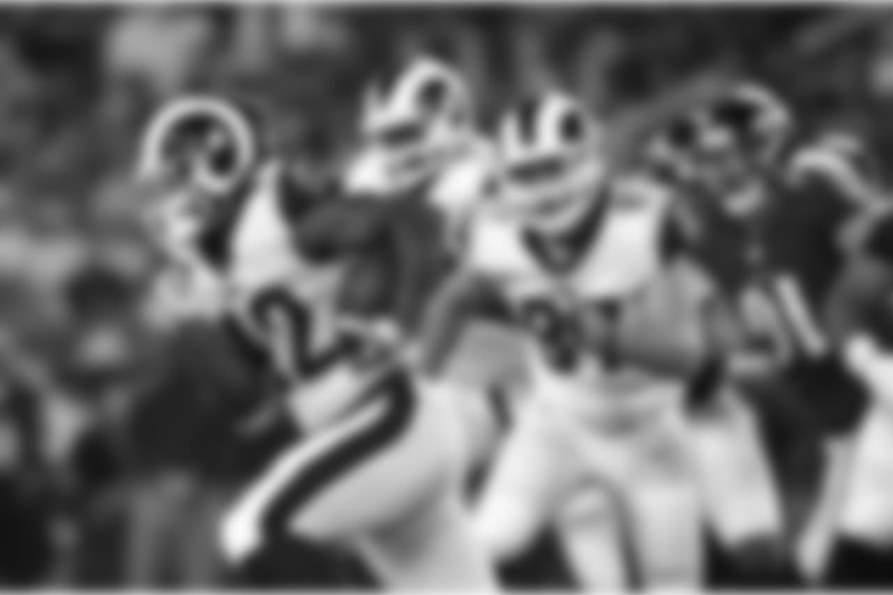 Los Angeles Rams running back John Kelly rushes the ball in the second half of a preseason NFL football game against the Baltimore Ravens, Thursday, Aug. 9, 2018, in Baltimore. (AP Photo/Gail Burton)