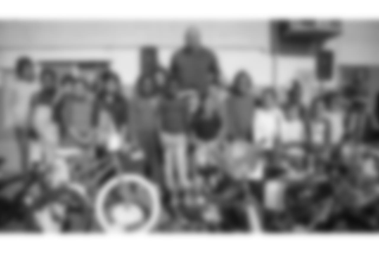 Left Tackle Andrew Whitworth of The Los Angeles Rams gives away over 600 bikes and helmets to Grape Street Elementary Tuesday, December 12th, 2017 in Los Angeles, CA.(Rams/Hiro Ueno)
