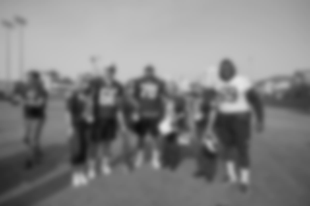 (66) Austin Blythe, (69) Sebastian Joseph-Day, and (70) Joseph Noteboom of the Los Angeles Rams greet Tragedy Assistance Program for Survivors families after a walk through , Saturday, November 10, 2018, in Los Angeles, CA. (Jeff Lewis/Rams)