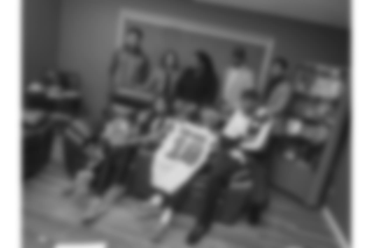 The Kirkwood family poses for a family photograph in the living room of New Orleans Saints wide receiver Keith Kirkwood's childhood home in Neptune Township, New Jersey.
