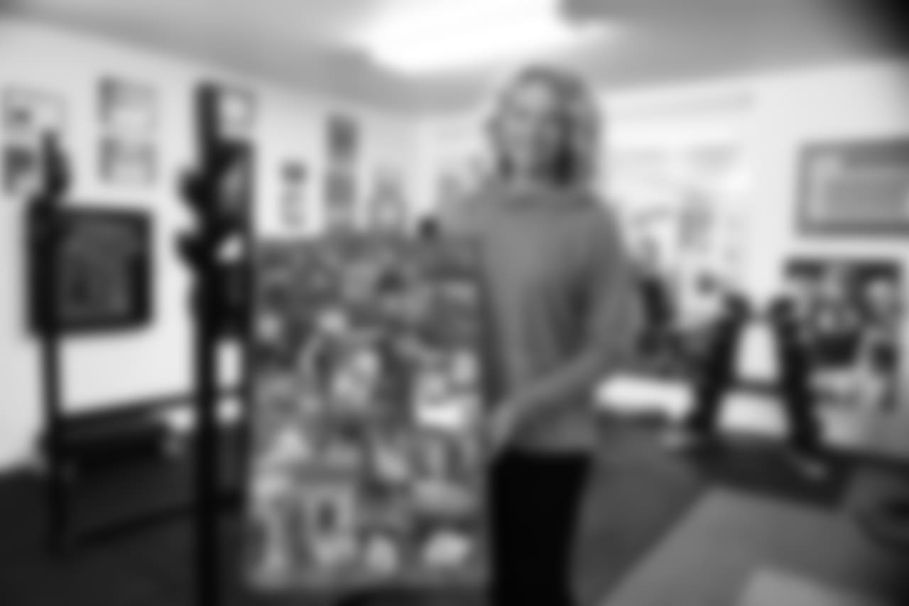 Jamie Biegel proudly displays her son's high school senior poster.