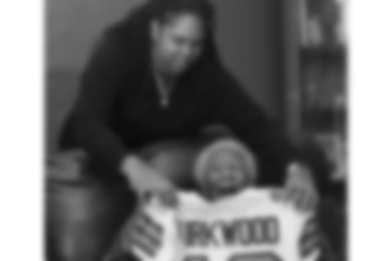 NEPTUNE TWP., N.J. - Marissa Kirkwood, 28, helps her grandmother, Mildred Kirkwood, 95, prepare for a family photo in the childhood home of New Orleans Saints wide receiver Keith Kirkwood. (