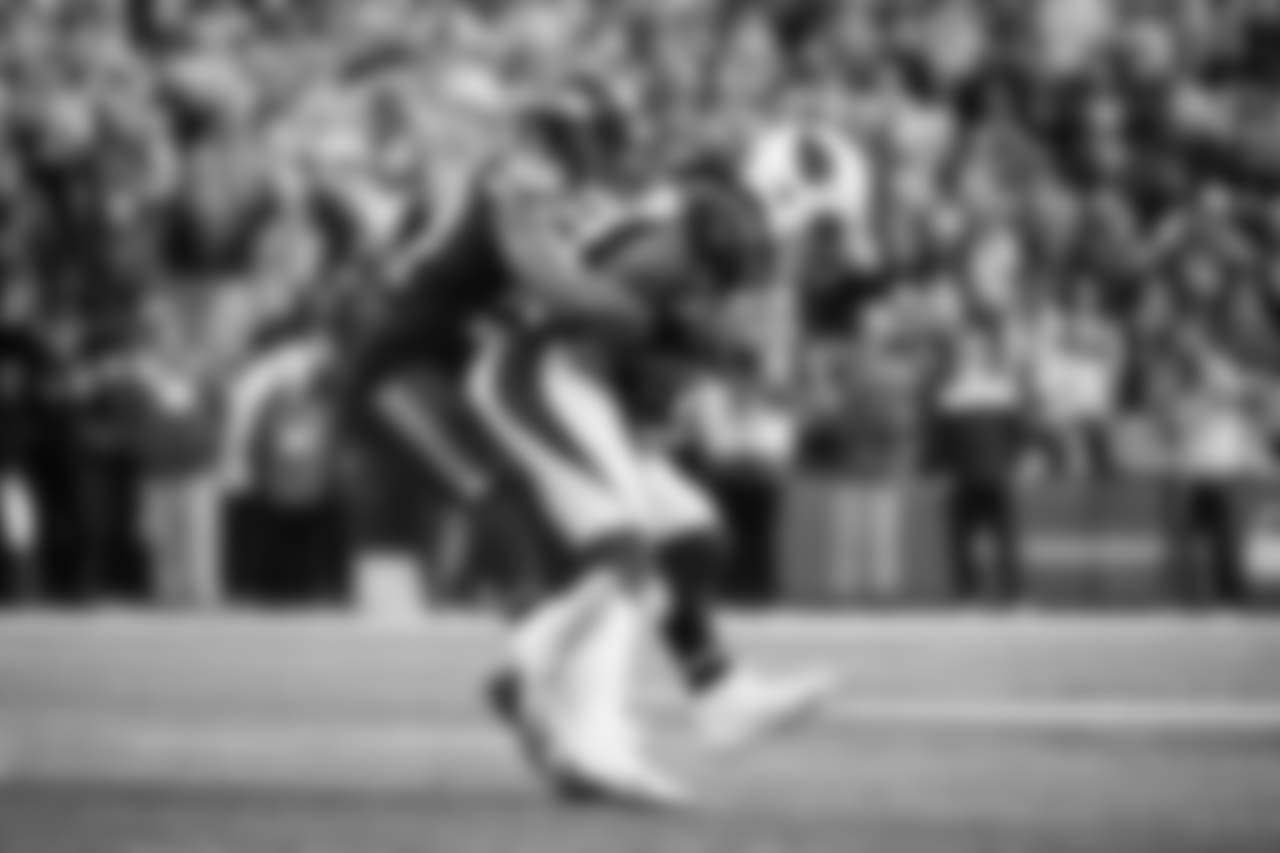 Seattle middle linebacker Bobby Wagner brings down Arizona receiver Larry Fitzgerald.