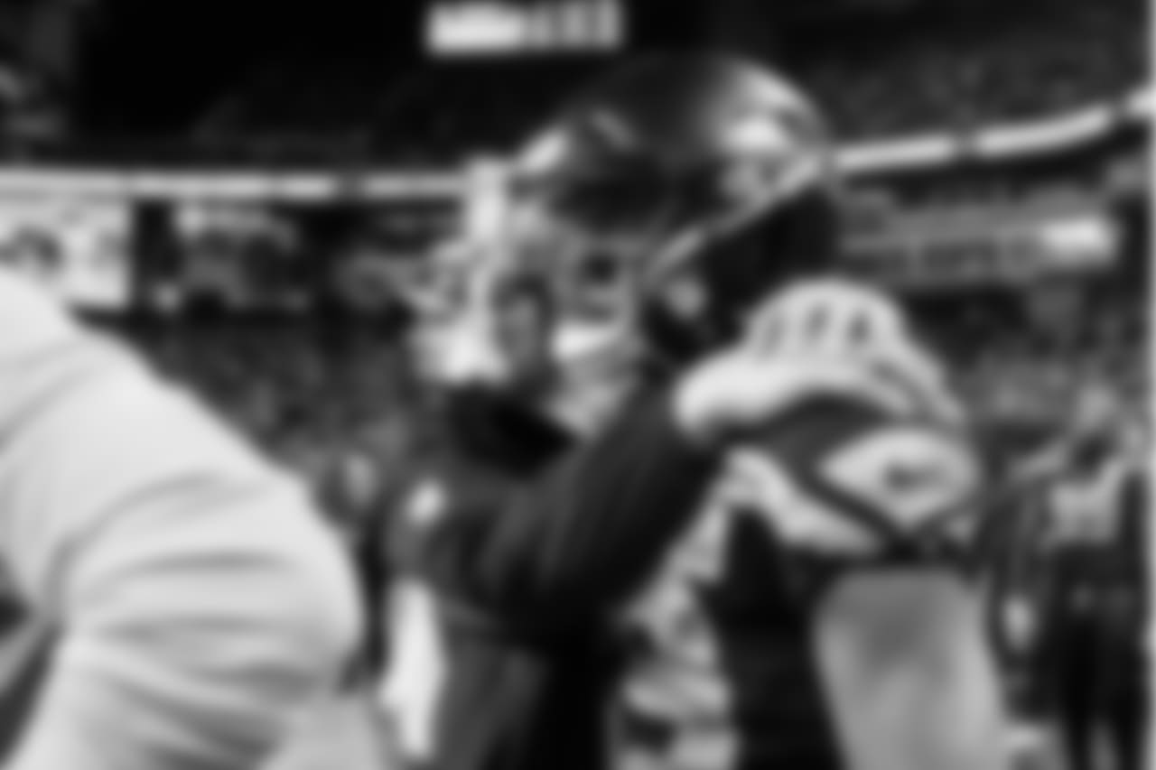 Head coach Pete Carroll puts his arms around receiver Doug Baldwin as the clock ticks down on the victory over the Chiefs, clinching a playoff berth for the Seahawks.
