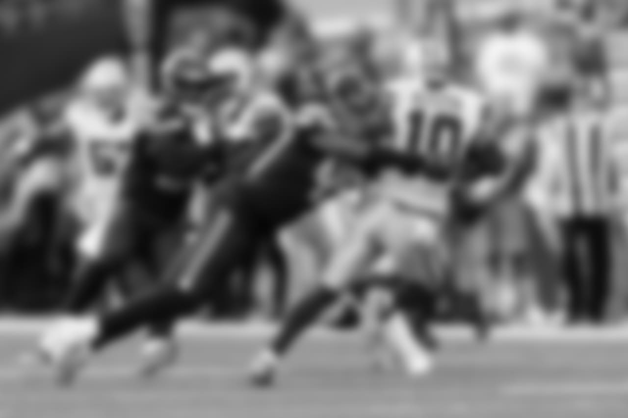 Linebacker Shaquem Griffin is the first man downfield and makes a tackle on Cowboys punt returner Tavon Austin.