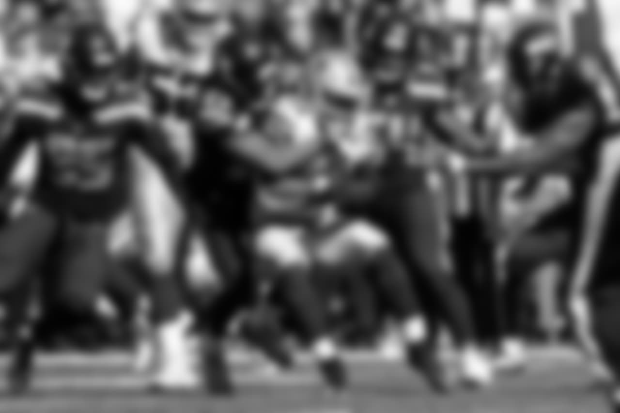 Seahawks safety Earl Thomas corrals Cowboys running back Ezekiel Elliott as teammates Dion Jordan and Bobby Wagner close in.