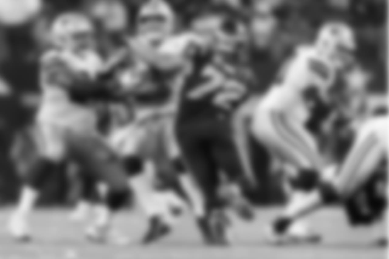 Seattle's Michael Bennett sakes Dak Prescott late in the game.