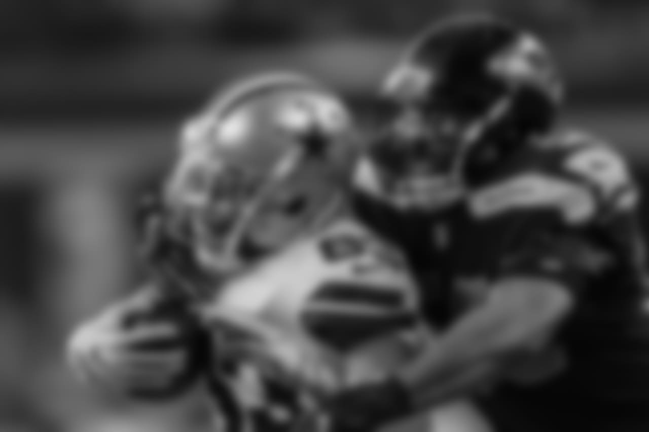 Seattle's K.J. Wright tackles Dallas' Terrance Williams in the first half.
