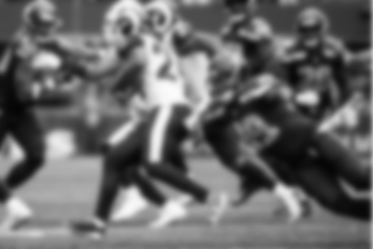 Seattle's Shaquem Griffin dives at Los Angeles returner Blake Countess.
