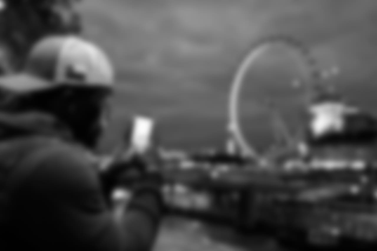 Seahawks receiver David Moore uses his mobile device to photograph the "London Eye", a giant ferris wheel.