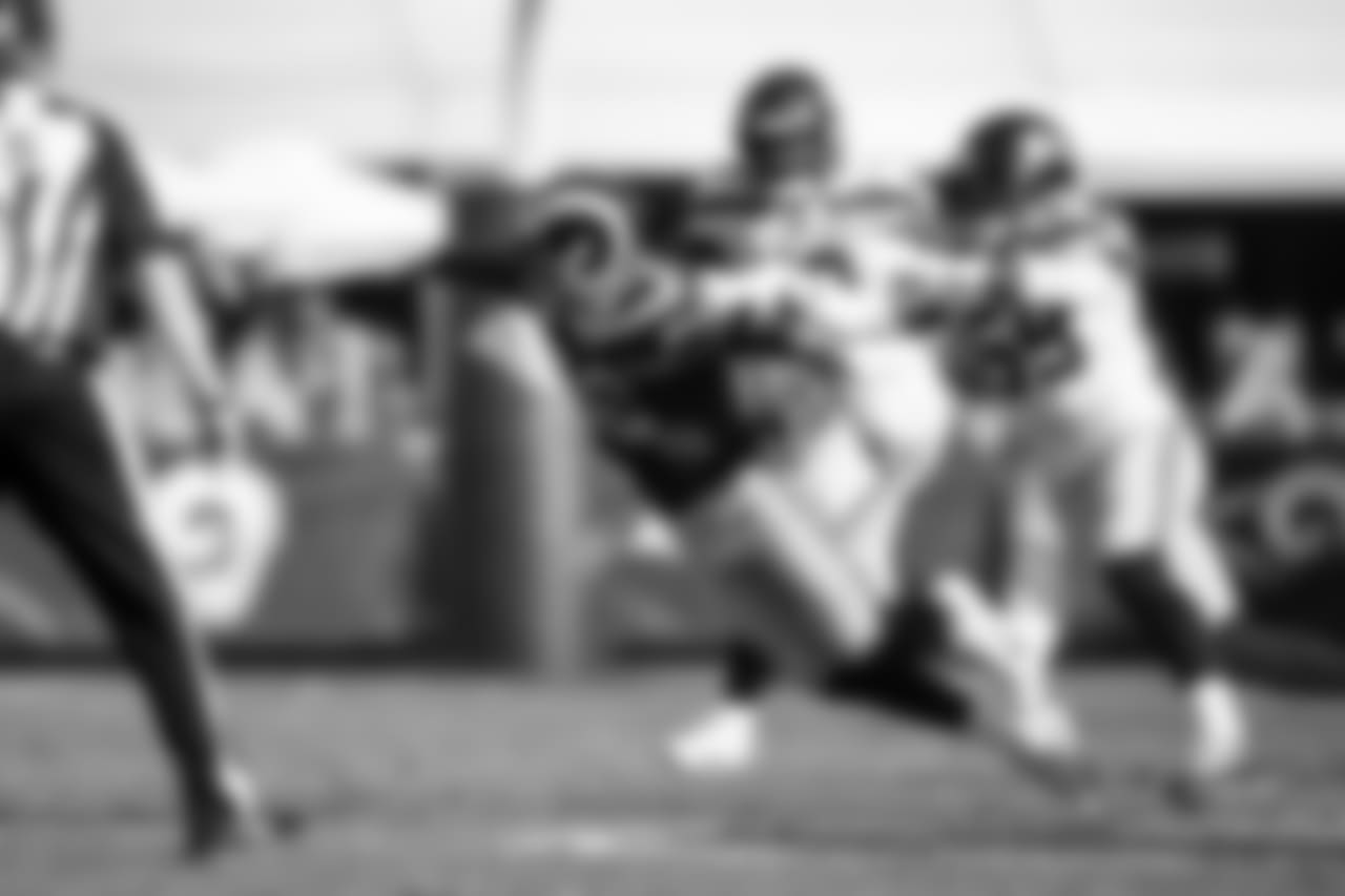 Seattle's Jacob Martin forces Rams quarterback Jared Goff into an off-balance throw.