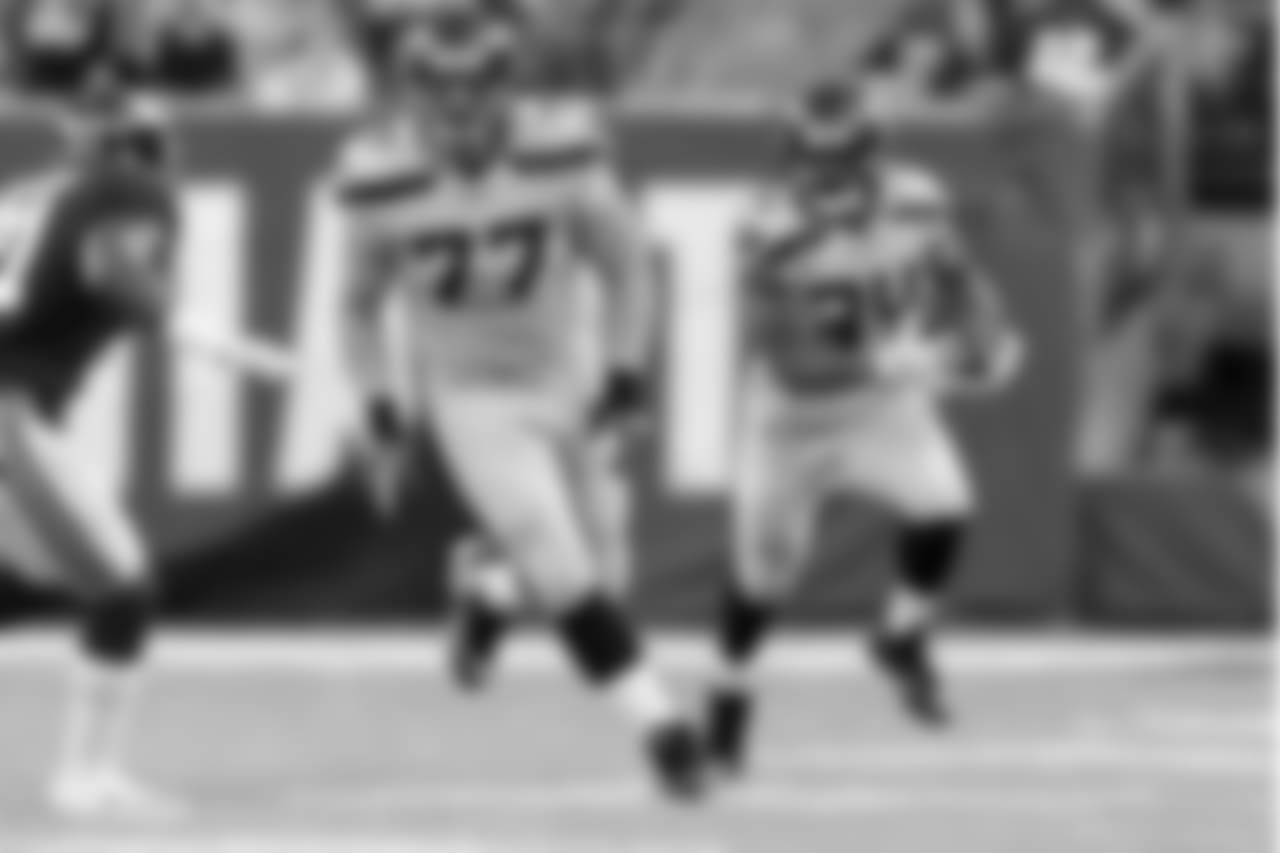Offensive guard Ethan Pocic, getting his first NFL start, leads the way for running back Thomas Rawls.