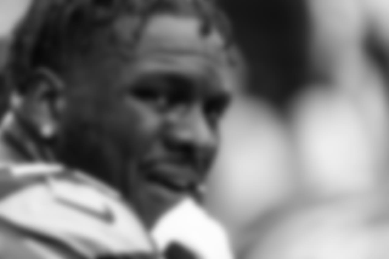 Defensive end Frank Clark sits on the sidelines between series.