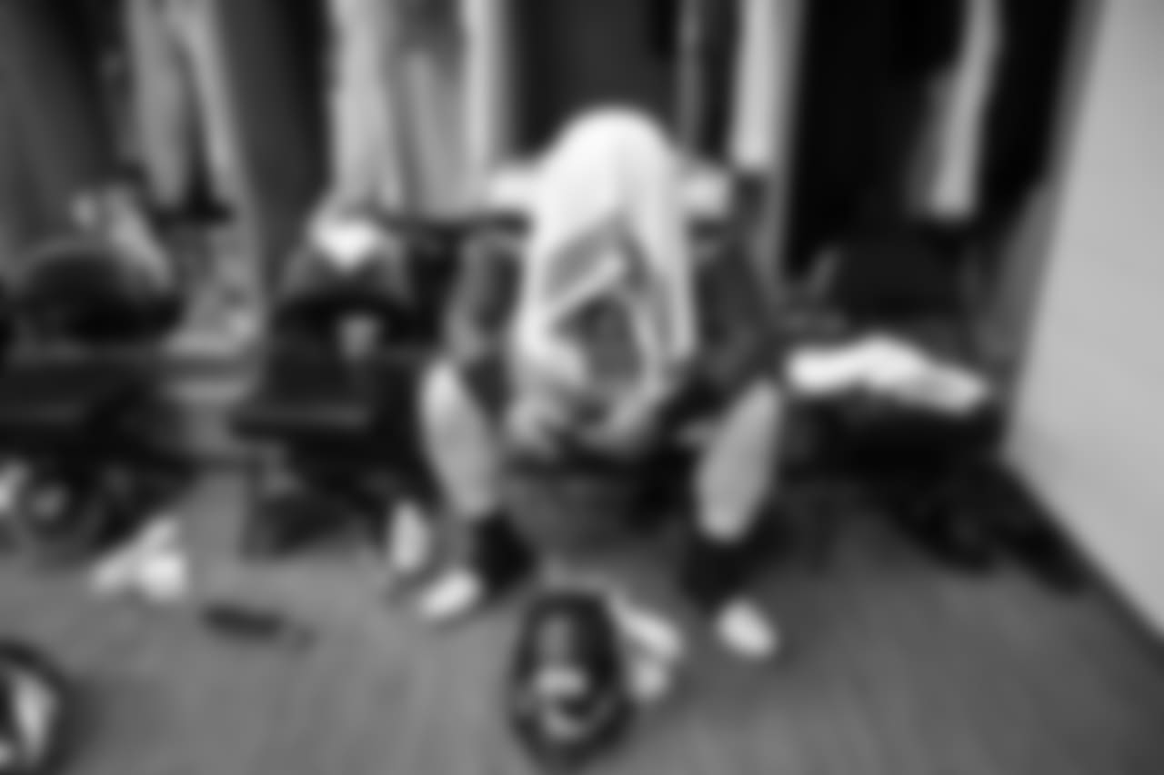 In the visitors locker room, Sheldon Richardson waits for the call to leave the locker room for kickoff.