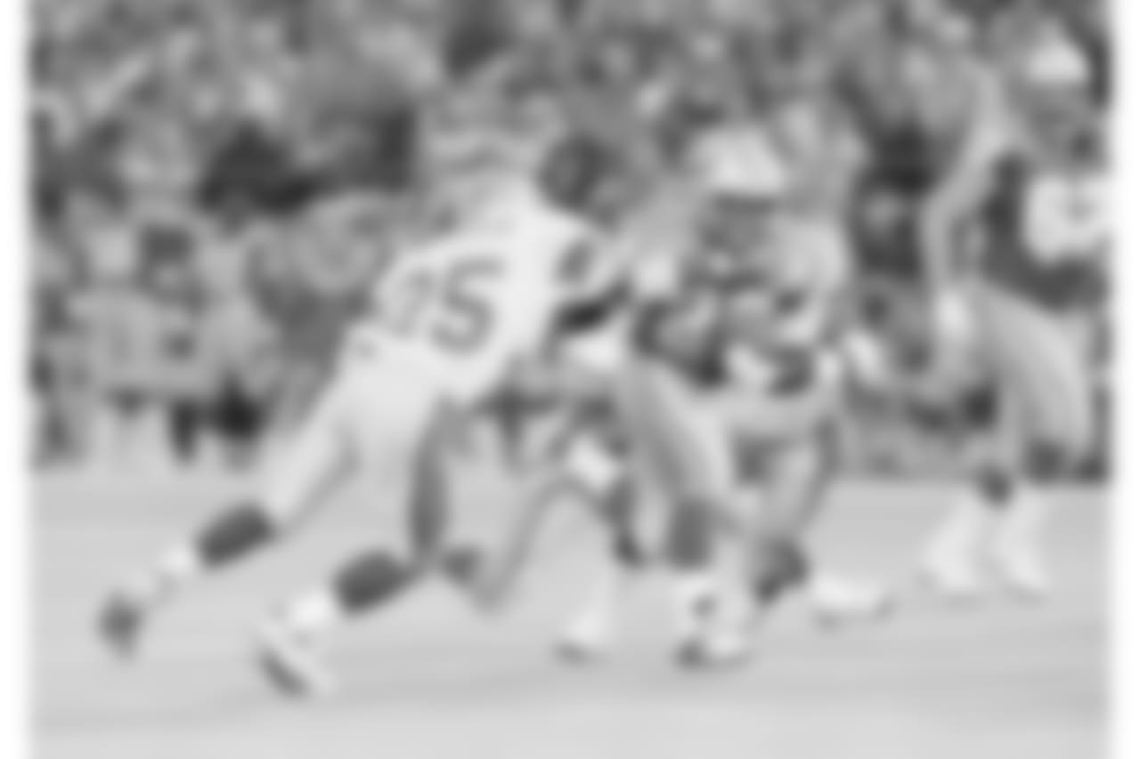Detroit Lions running back Barry Sanders (20) fights for yardage against Seattle Seahawks' Robert Blackmon (25) during the second quarter at the Silverdome in Pontiac, Mich., Oct. 17, 1993. (AP Photo/Duane Burleson)