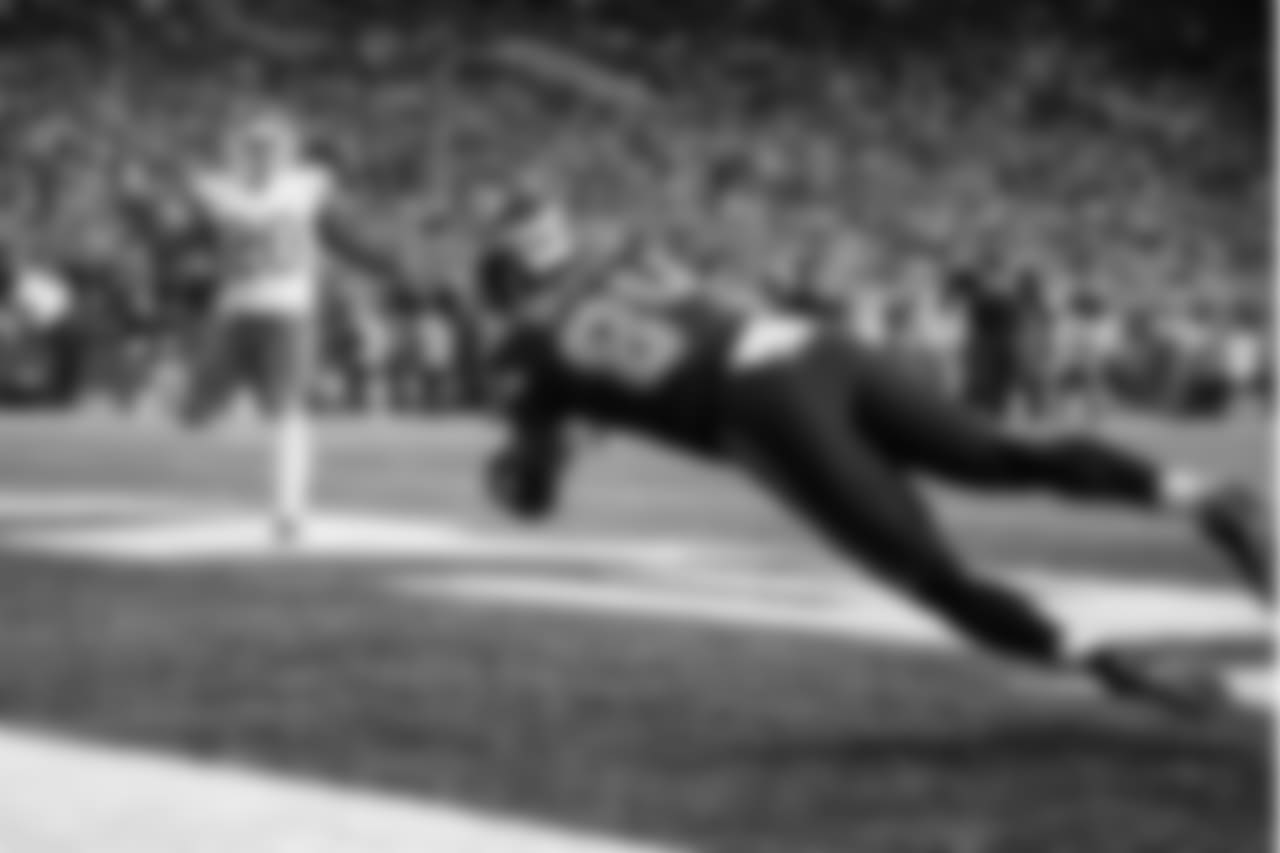 Seattle's Ed Dickson dives across the middle to corral a touchdown pass from Russell Wilson in the third quarter.